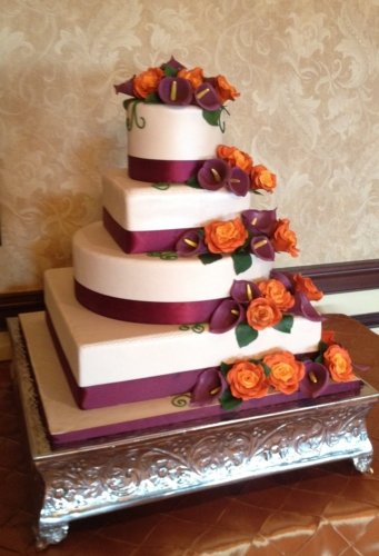 burgundy cake on square stand