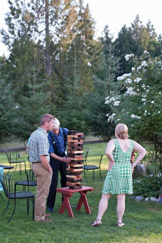 wedding-guests-playing-giant-jenga-during-ourdoor-wedding
