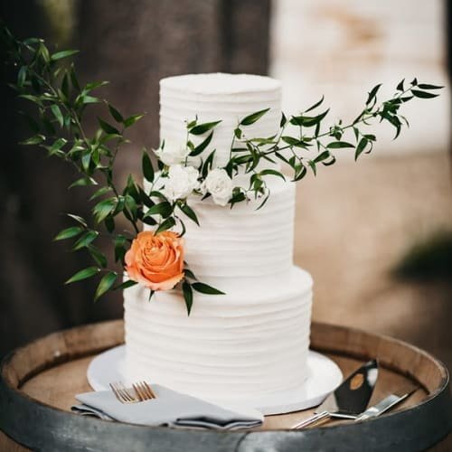 white wedding cake with flowers